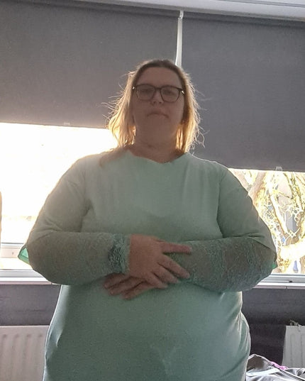 Kante top met roosjes